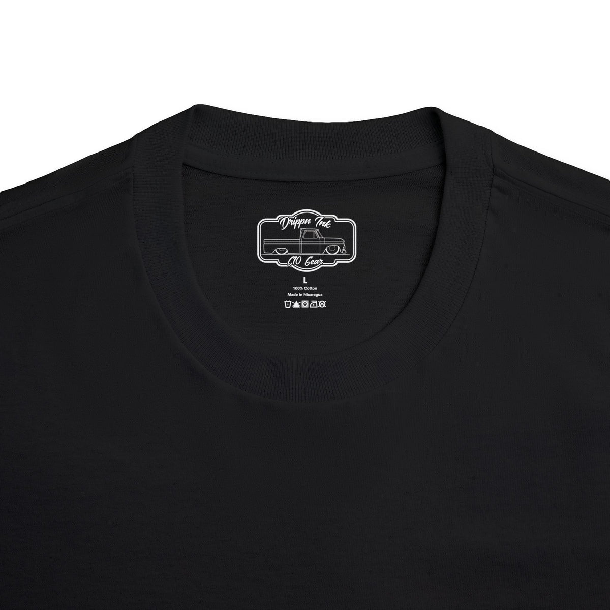 Close up of the Drippn Ink woven neck label inside a black Smoke'n Stepside t-shirt, size L, 100 percent cotton