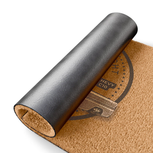 The doormat rolled up at one end, showing the black non-slip rubber backing underneath.