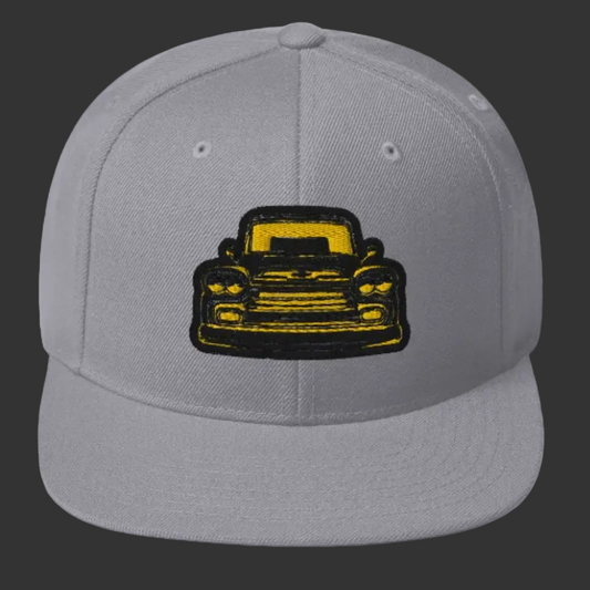 Product mockupDrippnInk Chevy snapback hat featuring a 59 chevy Apache black and yellow graphic on front