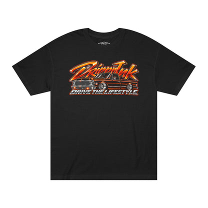 Front of a black Drive the Lifestyle t-shirt with an orange and chrome graphic of a slammed Chevy C10 pickup