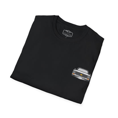 The black t-shirt folded to show the small chest print of the squarebody pickup front end.