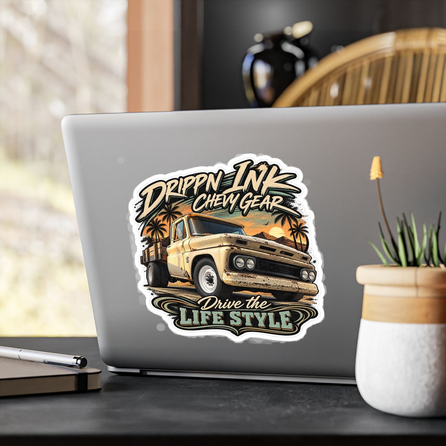 Chevy C20 dually flatbed sticker showing a 1964 truck with wooden stake sides and rust against an Arizona desert sunset with palms, kiss-cut vinyl decal by Drippn Ink