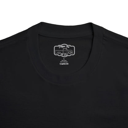 Close up of the Drippn Ink woven neck label inside a black Smoke'n Stepside t-shirt, size L, 100 percent cotton