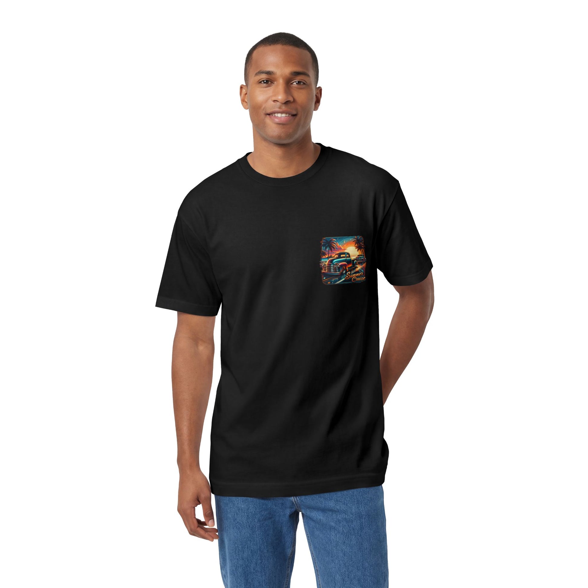 A man wearing the black t-shirt, showing the small chest print of the beach sunset scene.