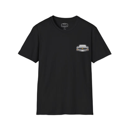Black t-shirt seen from the front with a small left chest print of a squarebody pickup truck front end.