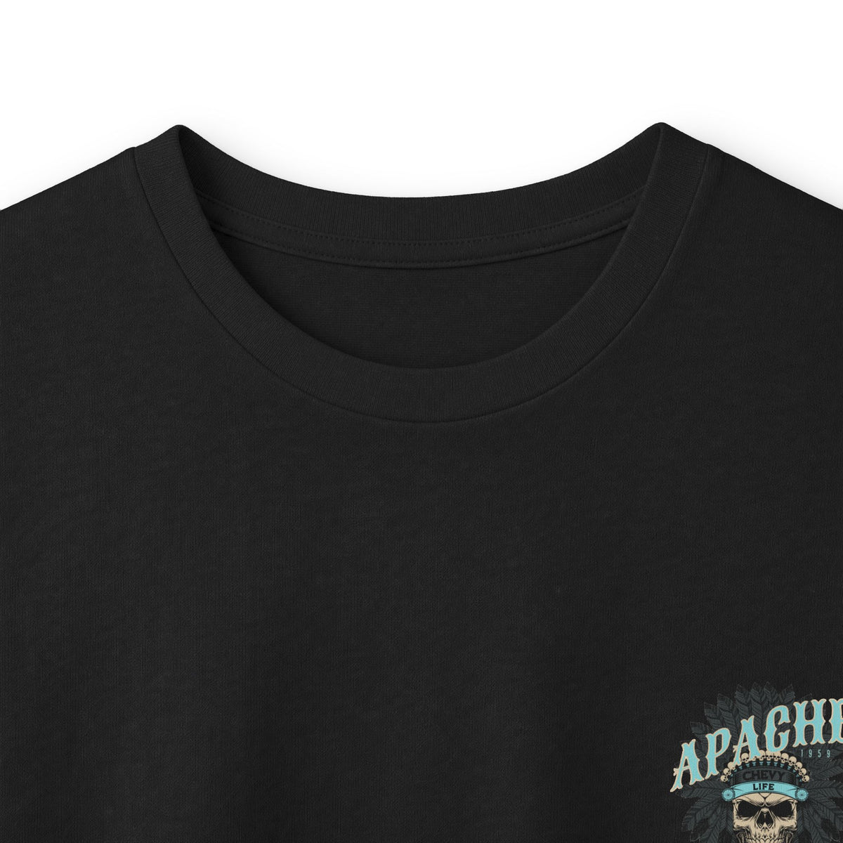 Close crop of the black long sleeve showing part of the Apache lettering against the fabric.