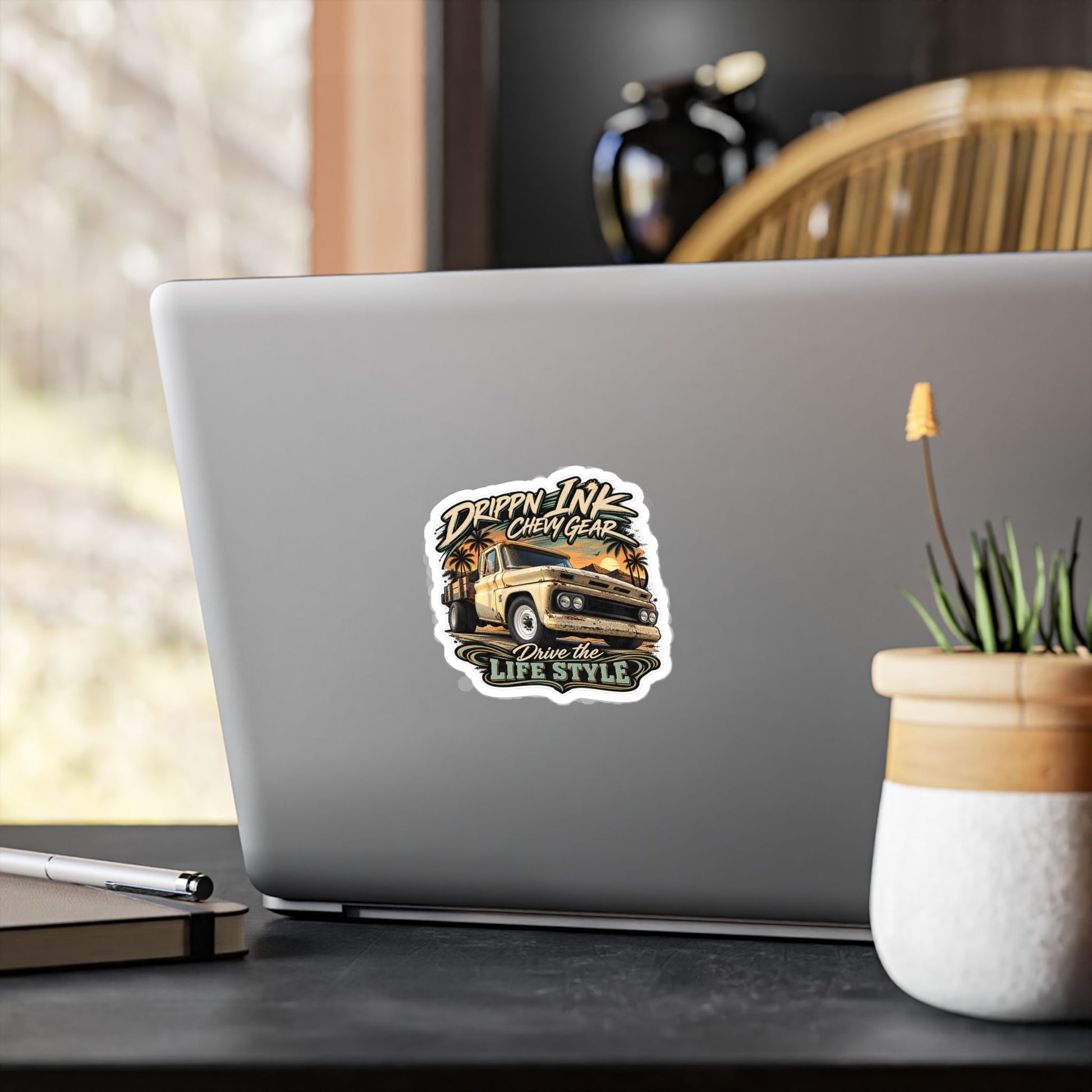 Chevy C20 dually flatbed sticker showing a 1964 truck with wooden stake sides and rust against an Arizona desert sunset with palms, kiss-cut vinyl decal by Drippn Ink