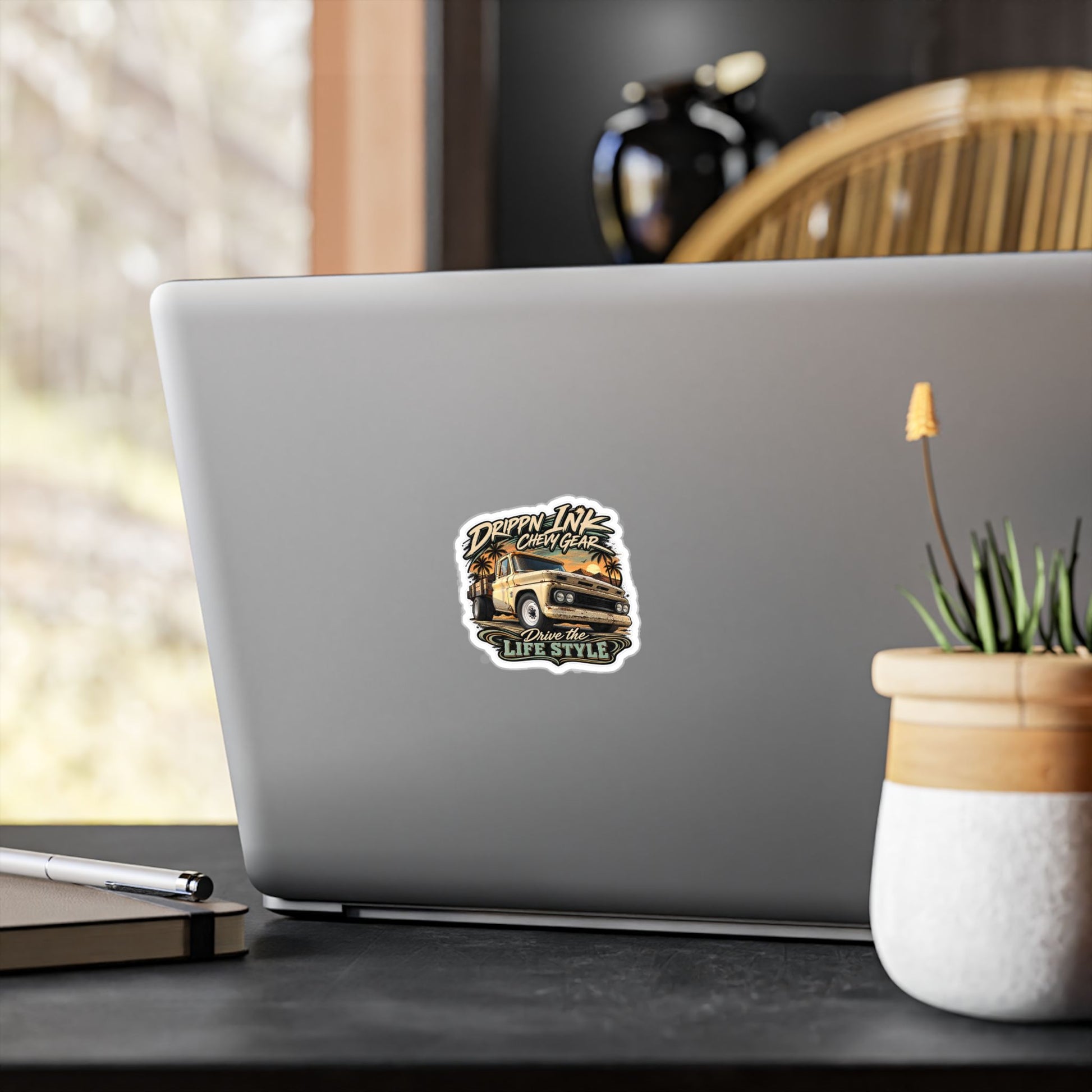 Chevy C20 dually flatbed sticker showing a 1964 truck with wooden stake sides and rust against an Arizona desert sunset with palms, kiss-cut vinyl decal by Drippn Ink