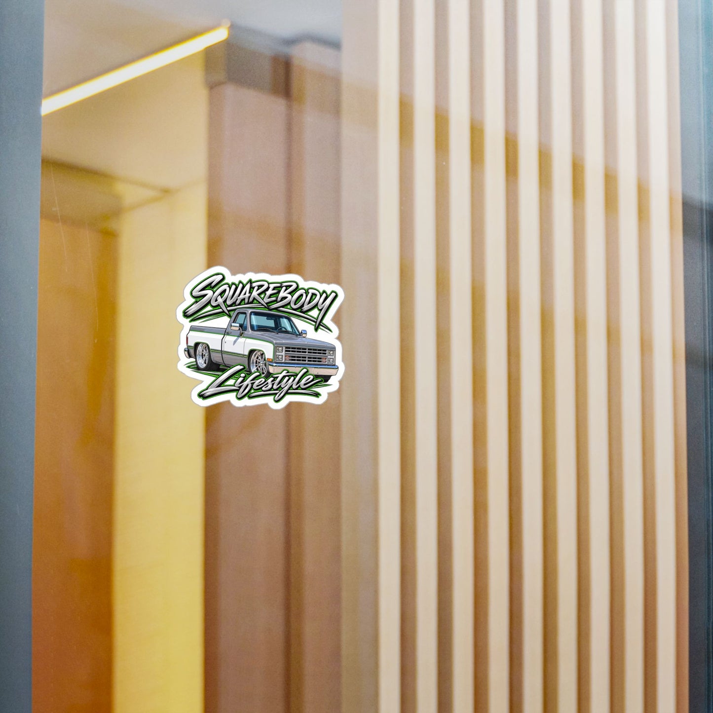 Chevy squarebody sticker showing a slammed 1980s C10 in silver and white with green pinstripes on polished billet wheels, kiss-cut vinyl decal by Drippn Ink