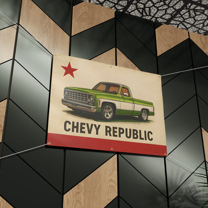 The banner mounted indoors on a dark geometric feature wall of black and wood panels.