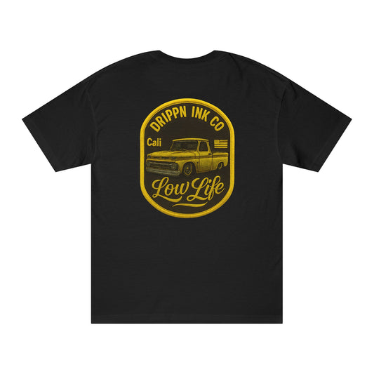 Back of the black t-shirt with a large gold badge print: Drippn Ink Co arched above a lowered classic pickup, Cali and a small US flag beside it, and Low Life in script below.