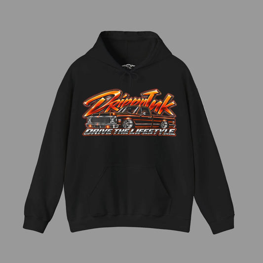 Front of a black Drive the Lifestyle hoodie with an orange and chrome graphic of a slammed Chevy C10 pickup