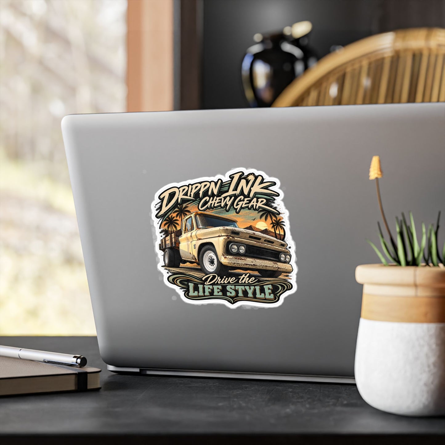 Chevy C20 dually flatbed sticker showing a 1964 truck with wooden stake sides and rust against an Arizona desert sunset with palms, kiss-cut vinyl decal by Drippn Ink