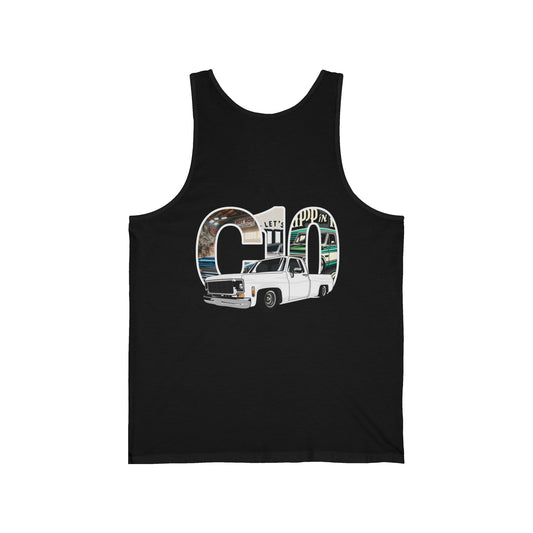 Big C10 Sqarebody This stylish Tank Top features a bold, eye-catching design that celebrates the classic Chevy C10 square body truck. Dominating the scene is the iconic outline of the C10, filled with detailed illustrations that pay homage to the vintage automotive culture.