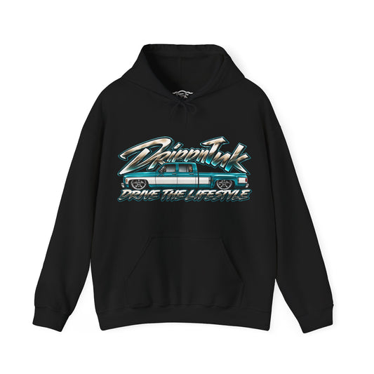 Front of a black Drive the Lifestyle hoodie with a teal and white slammed Chevy squarebody dually graphic