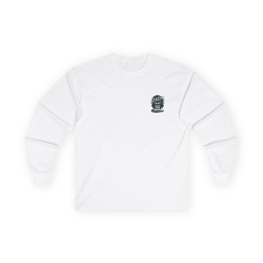 White long sleeve t-shirt laid flat with a small left chest print of a skull in a feathered headdress above a classic pickup truck.