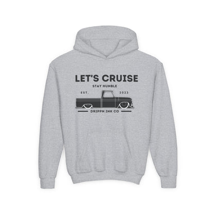Grey kids hoodie laid flat, front print reading Let's Cruise above Stay Humble, a lowered classic pickup truck, and Drippn Ink Co along the bottom.