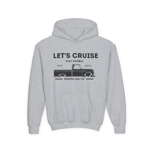 Grey kids hoodie laid flat, front print reading Let's Cruise above Stay Humble, a lowered classic pickup truck, and Drippn Ink Co along the bottom.