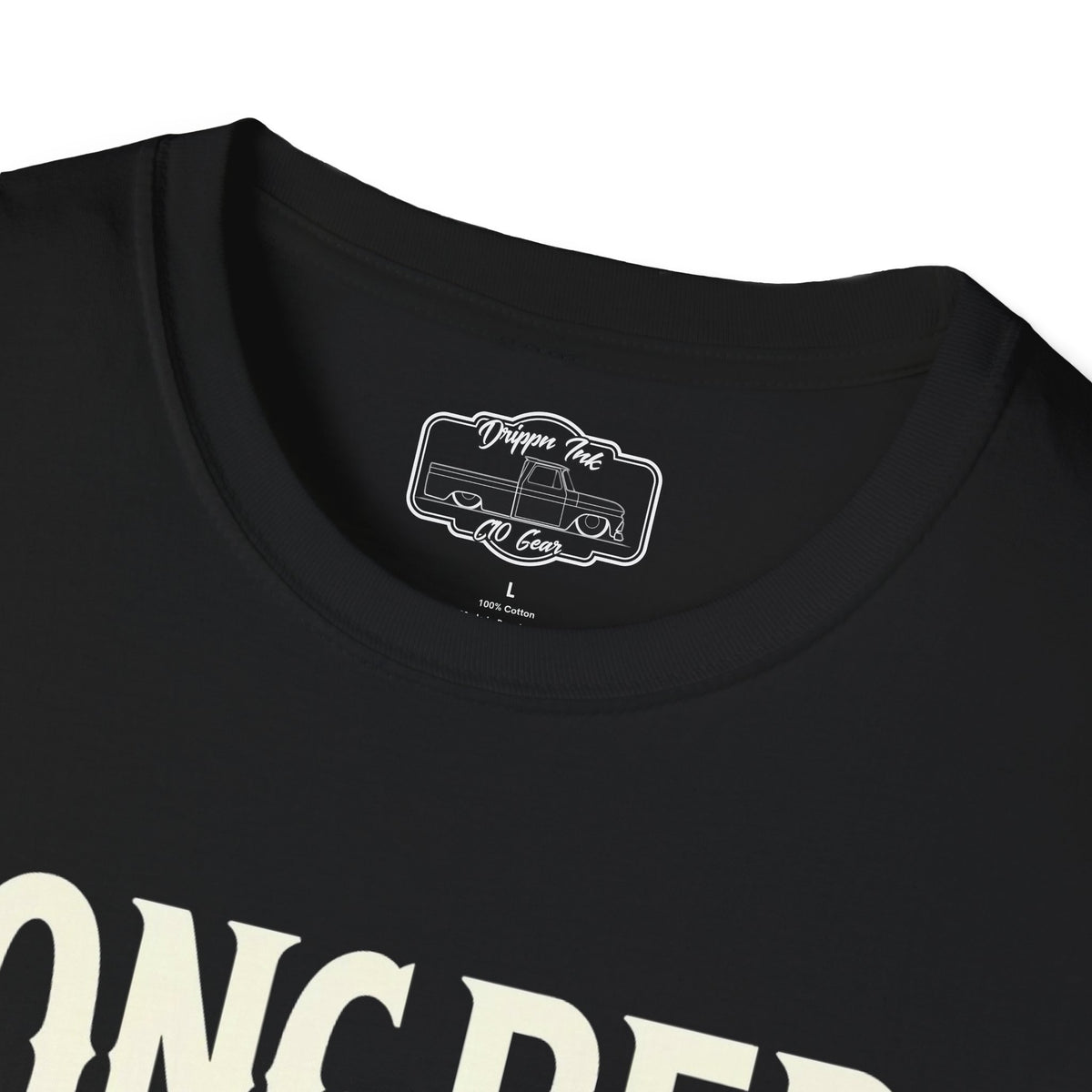 Close view of the shirt's inside neck label, a printed Drippn Ink C10 Gear badge, with part of the Longbed print below it.