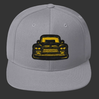 Product mockupDrippnInk Chevy snapback hat featuring  a 59 chevy Apache black and yellow graphic on front